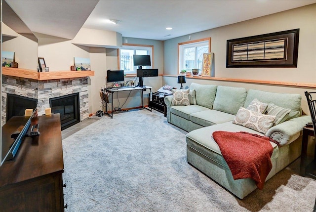 carpeted living room with a fireplace