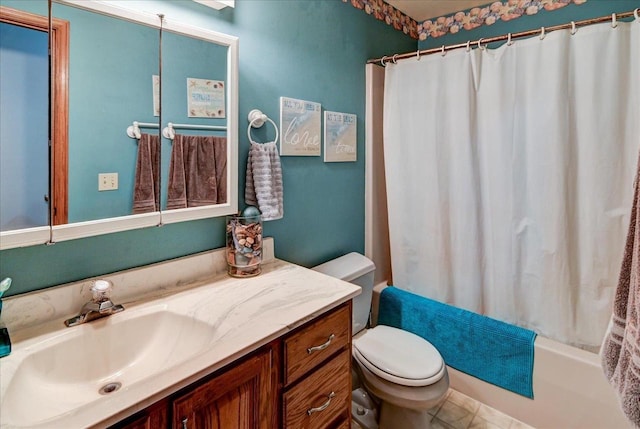 full bathroom featuring tile patterned flooring, vanity, toilet, and shower / bath combo with shower curtain