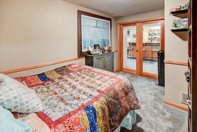 carpeted bedroom with access to outside and french doors