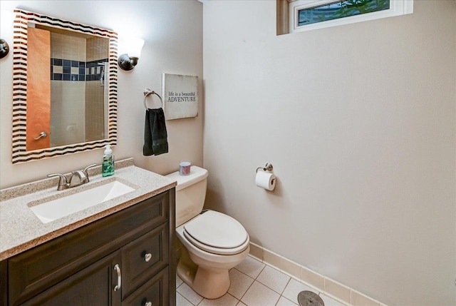 bathroom with tile patterned floors, vanity, and toilet