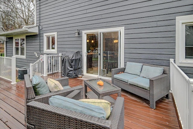 deck with an outdoor hangout area and central air condition unit