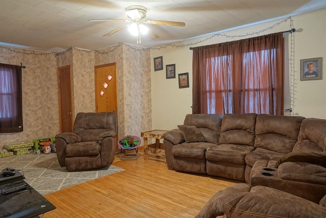 living room with ceiling fan, light hardwood / wood-style flooring, and plenty of natural light