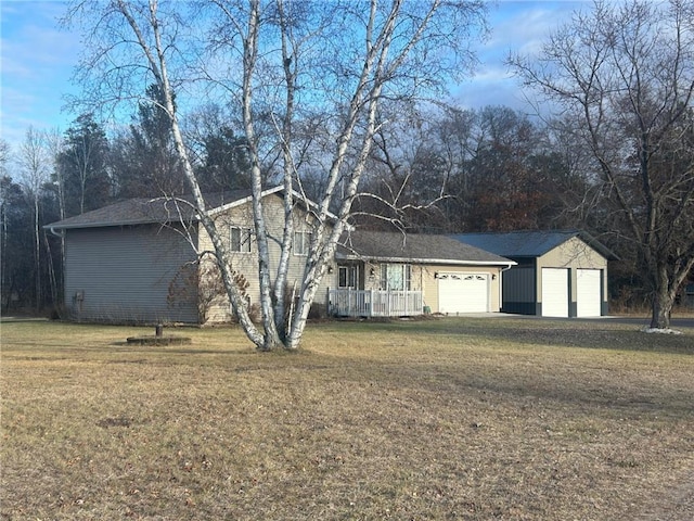 ranch-style home with a garage and a front lawn