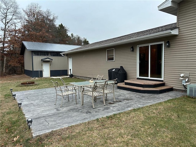 view of patio featuring central AC, a deck, and a grill