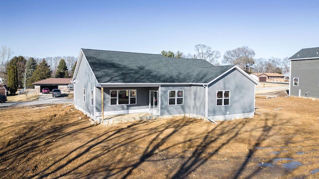 view of front of property with roof with shingles