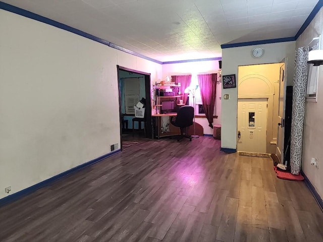 office space featuring crown molding and dark wood-type flooring