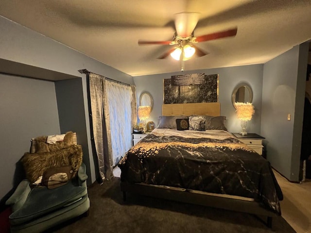 bedroom featuring a textured ceiling, carpet floors, and ceiling fan