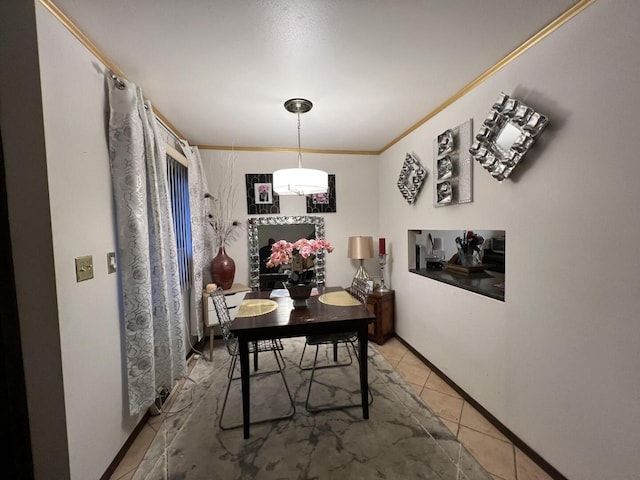 dining area with tile patterned floors and ornamental molding