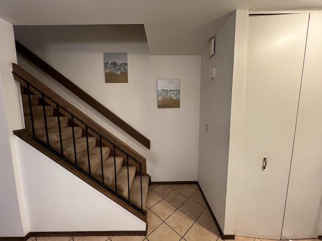 stairs with tile patterned flooring