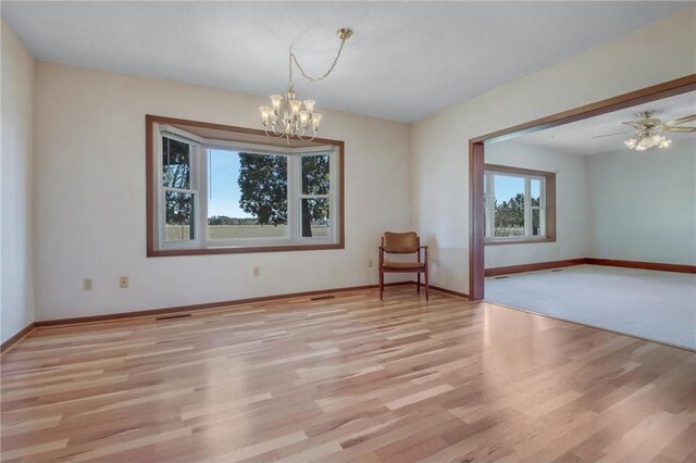 empty room with plenty of natural light and light wood-type flooring