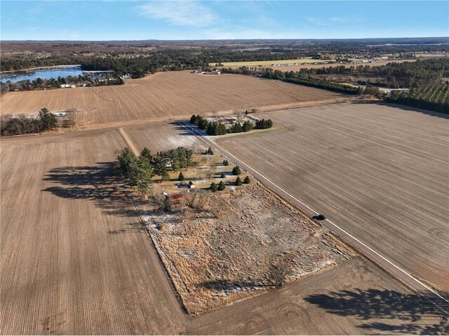 drone / aerial view featuring a rural view and a water view