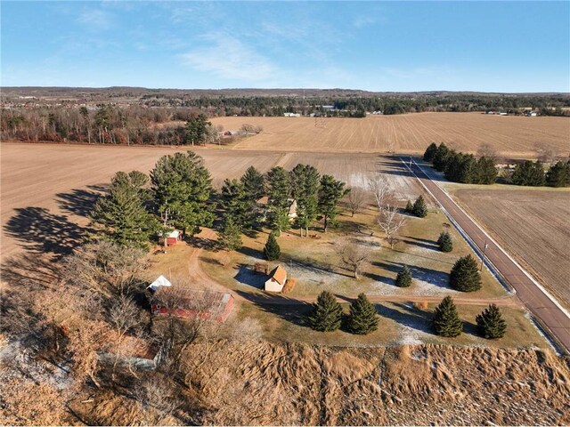 birds eye view of property with a rural view