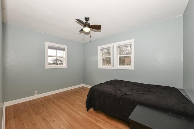 bedroom featuring light hardwood / wood-style flooring and ceiling fan