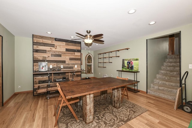 dining room featuring ceiling fan and light hardwood / wood-style flooring