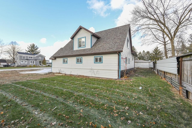 view of property exterior with a yard