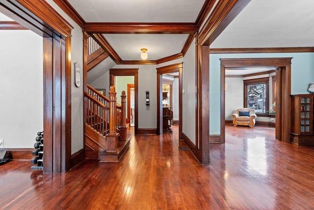 foyer entrance featuring dark hardwood / wood-style flooring and ornamental molding