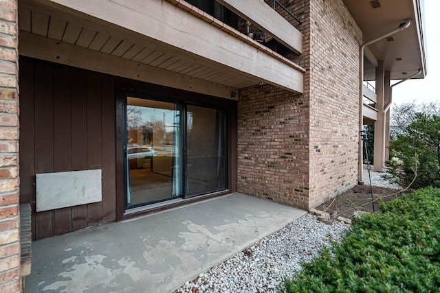 entrance to property featuring a patio