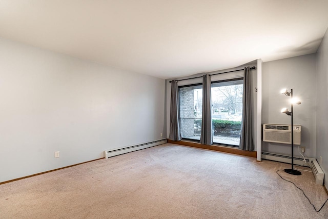 spare room featuring baseboard heating, a wall mounted AC, and light colored carpet