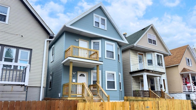 view of front of house featuring a balcony