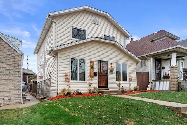 front facade featuring a front lawn