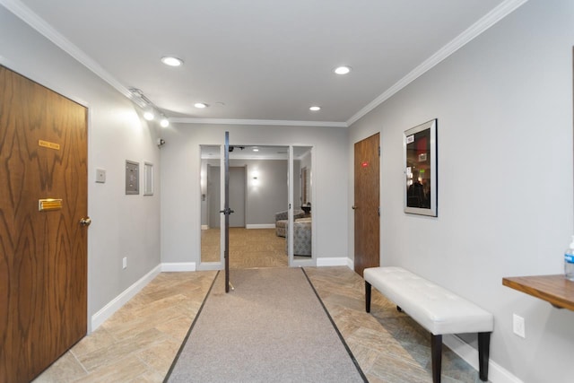 hall with crown molding and carpet floors