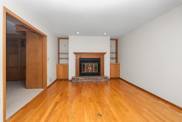 unfurnished living room featuring light wood-type flooring