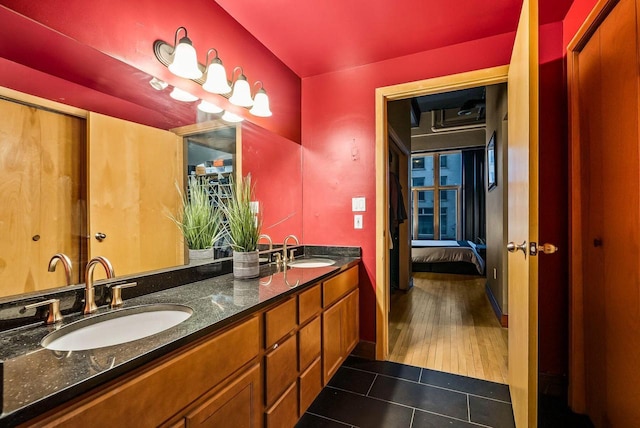 bathroom with vanity and hardwood / wood-style flooring