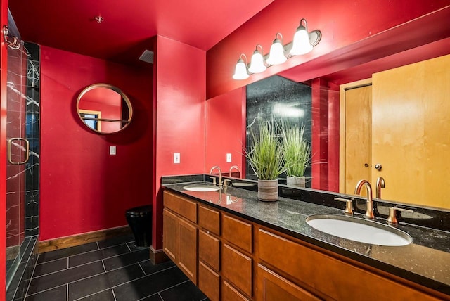 bathroom featuring tile patterned flooring and vanity