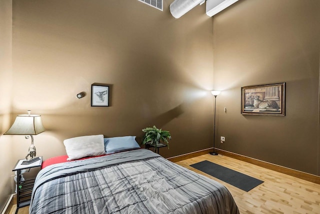 bedroom featuring hardwood / wood-style flooring