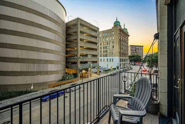 view of balcony at dusk