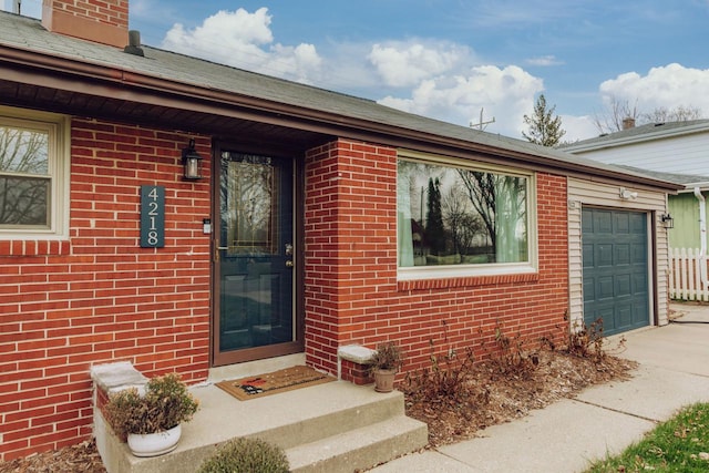 property entrance with a garage