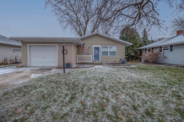 single story home featuring a front yard and a garage