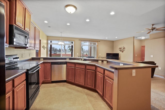 kitchen with light carpet, ceiling fan with notable chandelier, sink, black appliances, and hanging light fixtures