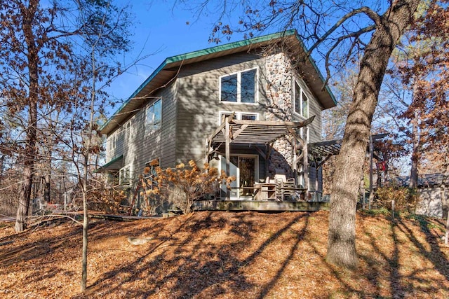 458 Pro Trl, Nekoosa, WI 54457 - rear view of property with stone siding and a wooden deck