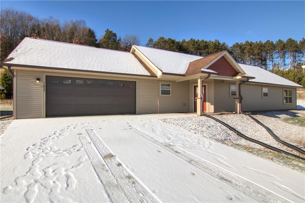 ranch-style house featuring a garage