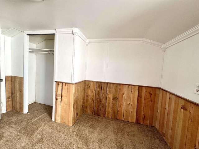 interior space featuring lofted ceiling and carpet floors