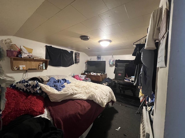 bedroom featuring lofted ceiling