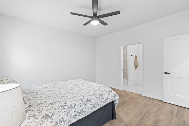 bedroom with ceiling fan, hardwood / wood-style floors, and ensuite bathroom