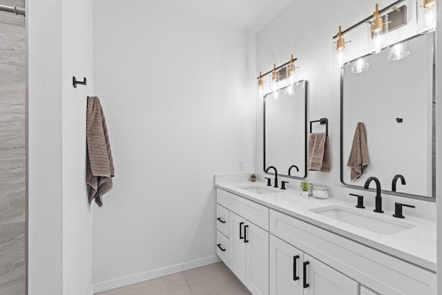 bathroom with tile patterned flooring and vanity