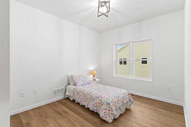 bedroom featuring wood-type flooring