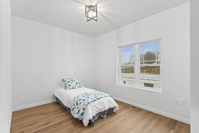 bedroom featuring hardwood / wood-style floors