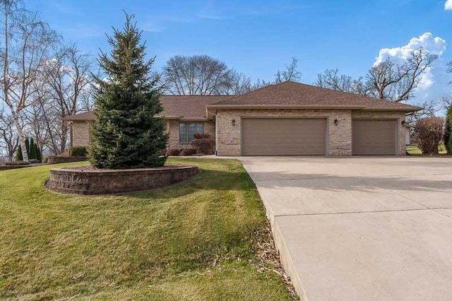 ranch-style house featuring a front lawn and a garage