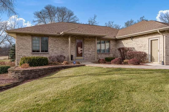 single story home featuring a front yard