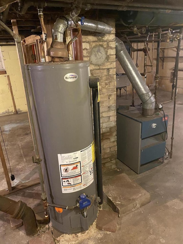 utility room featuring gas water heater