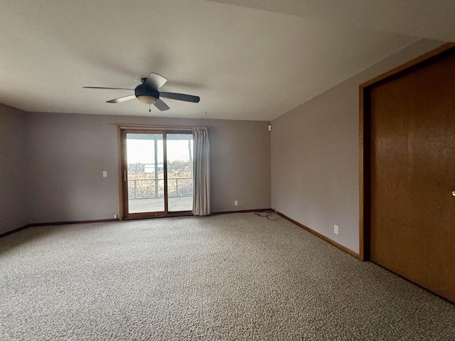 empty room with ceiling fan and carpet floors