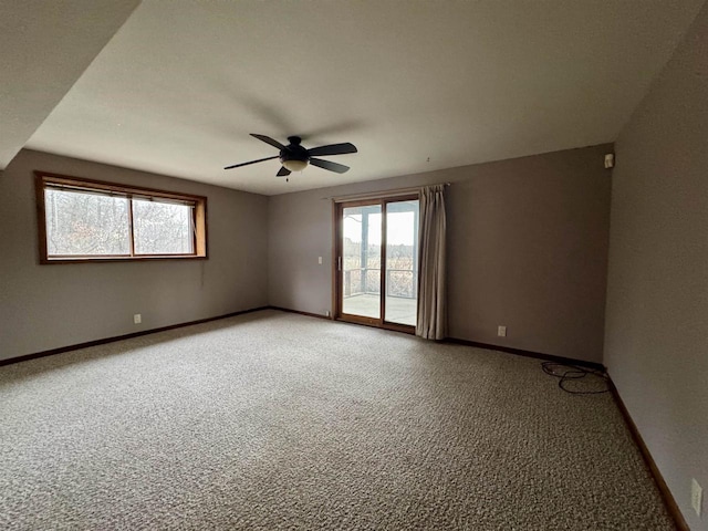 carpeted empty room with ceiling fan