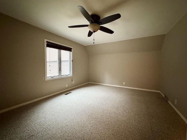 7409 Timberline Trl, Arena, WI 53503 - unfurnished room featuring ceiling fan, carpet floors, and lofted ceiling