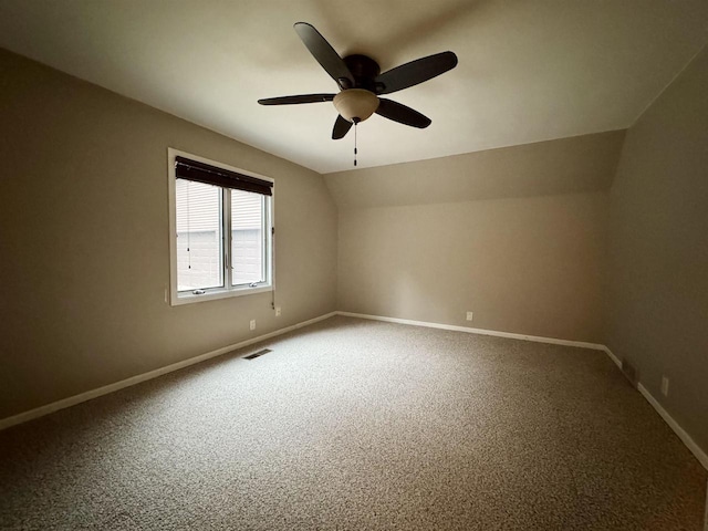 bonus room with ceiling fan, lofted ceiling, and carpet floors