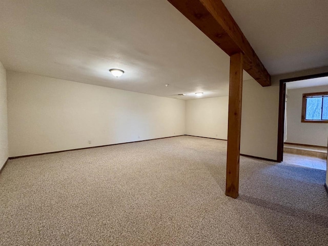 basement featuring light colored carpet