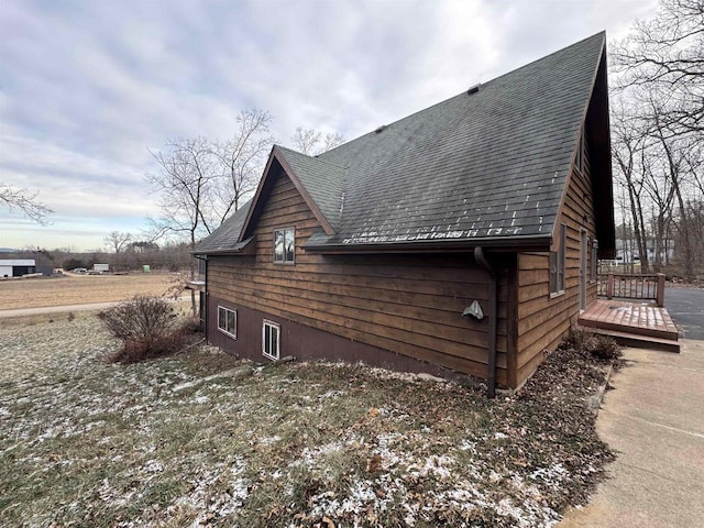 view of side of property with a deck